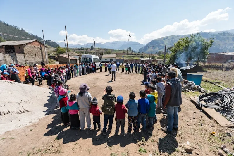 Community development team engaging with local residents in the field